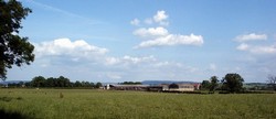 In the foreground and to the left of the farm is the field called Standard Leeze in the 1840s. This may be the actual site of the English battle formation and where the Standard was raised.