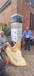 Prof Anne Curry and Kevin Winter unveiling the information pillar about the battlefield sculpture trail at Bosworth Battlefield Heritage Centre (Photo: David Austin)