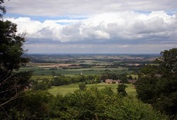 The view of the Vale of the Red Horse from the Castle Inn. The battlefield lies between Radway Grange and church in the foreground and Kineton village in the distance.
