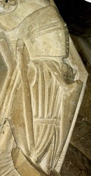 A mid 13th century knight with typical flat topped great helm, triangular shield and lance. As depicted on a mid 13th century capital in the church at Cottingham, Northamptonshire.