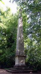 The Obelisk in the grounds of Abbey Manor House, erected in 1821 by Edward Rudge. It is now accessible by a permissive path via The Squires and the Leicester Tower.